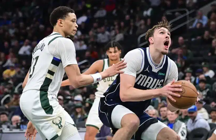 Dallas Mavericks forward Cooper Flagg (32) looks for a shot.