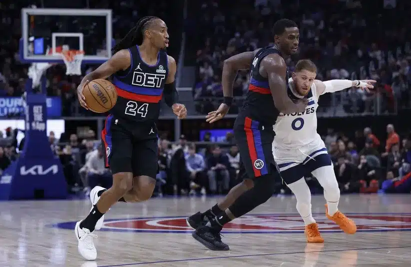 Detroit Pistons guard Daniss Jenkins (24) dribbles.