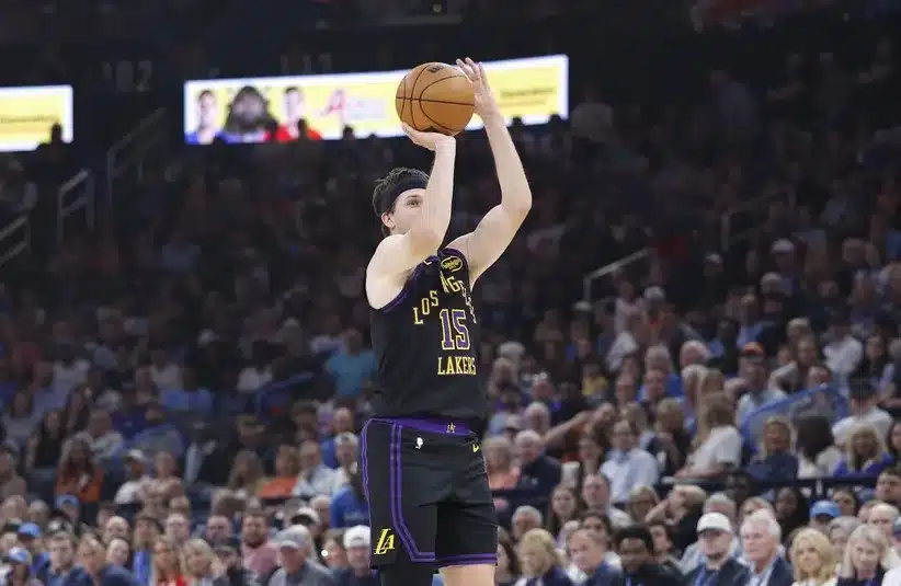 Los Angeles Lakers guard Austin Reaves (15) shoots a three point basket.
