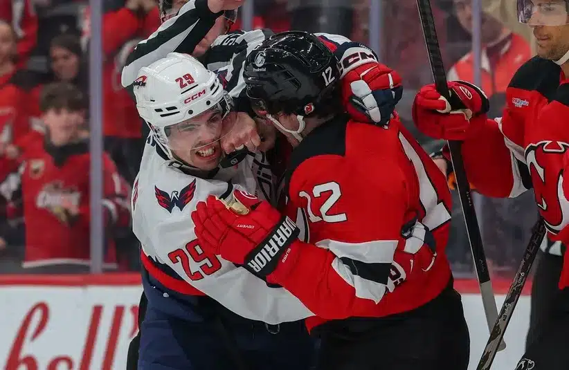 Washington Capitals center Hendrix Lapierre (29) and New Jersey Devils center Cody Glass (12) fight.