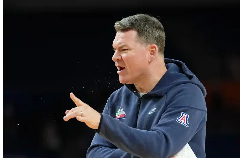Arizona Wildcats head coach Tommy Lloyd directs players during a practice session ahead of the Final Four