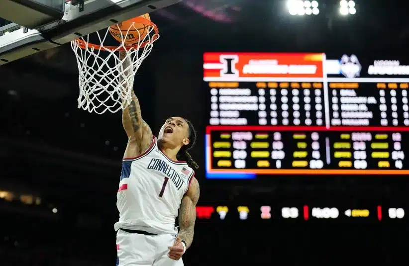 UConn Huskies guard Solo Ball (1) dunks.