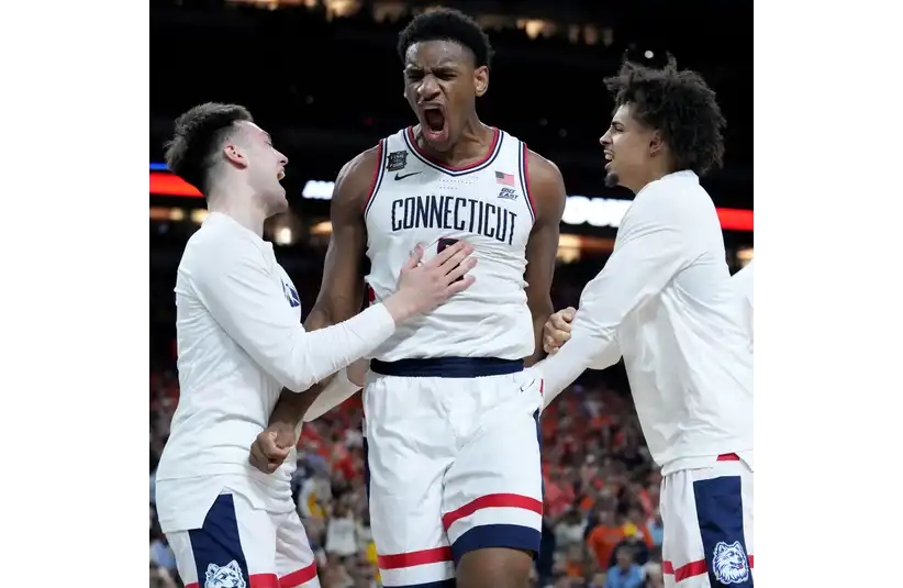 UConn Huskies celebrating on the court