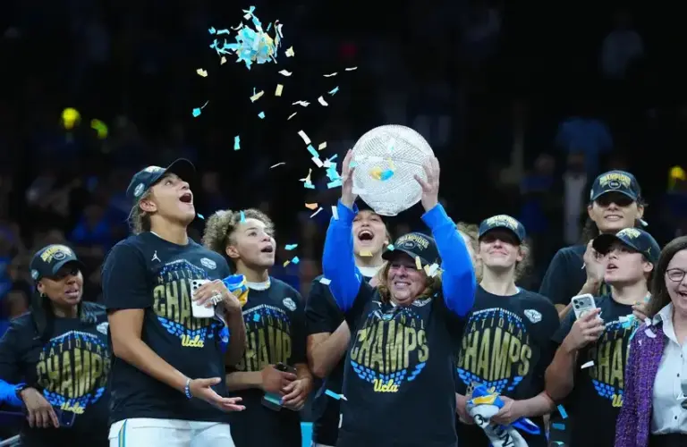 UCLA Bruins head coach Cori Close celebrates on the podium after defeating the South Carolina Gamecocks during the National Championship game of the women's 2026 NCAA Tournament.