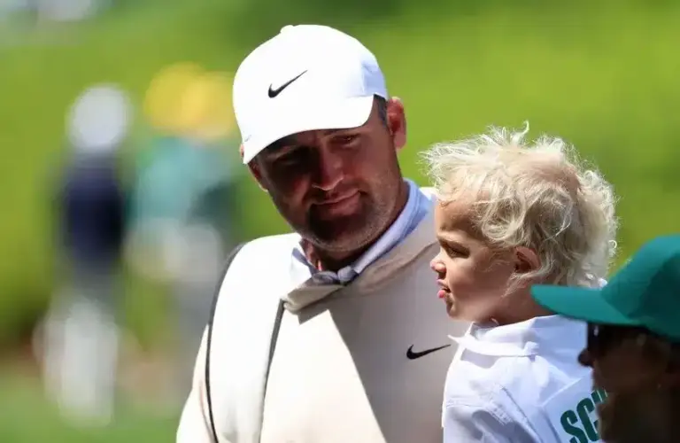 Scottie Scheffler and his son Bennett on the eighth green during the Par 3 Contest.