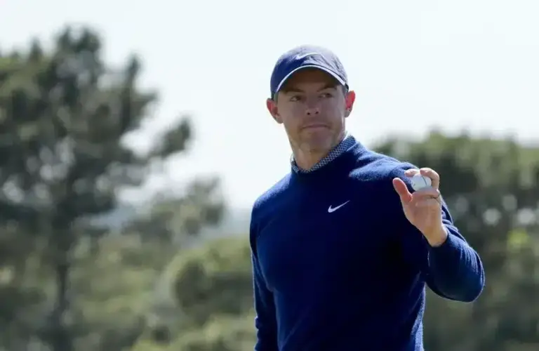 Rory McIlroy acknowledges the crowd on the 18th green during the first round of the Masters Tournament.