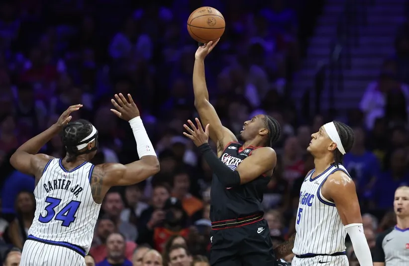 Philadelphia 76ers guard Tyrese Maxey (0) drives for a shot.