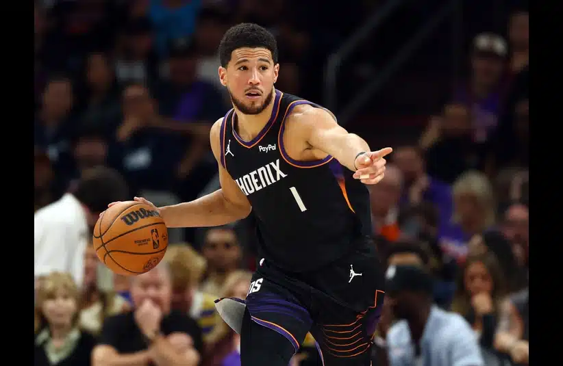 Phoenix Suns guard Devin Booker (1) against the Golden State Warriors during a Play-In Tournament game at Mortgage Matchup Center.