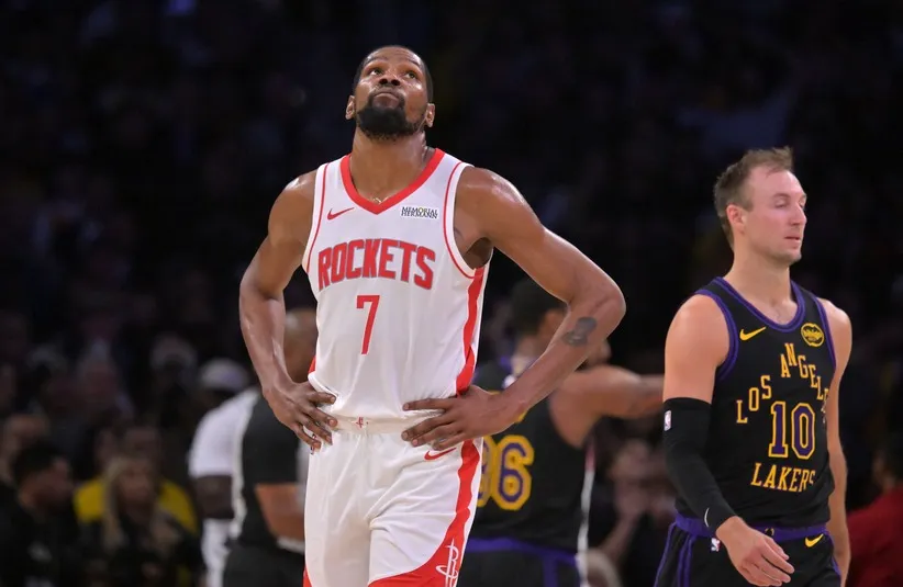 Houston Rockets forward Kevin Durant (7) looks on from the court.