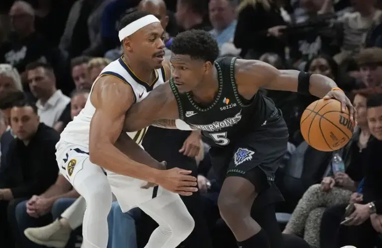Minnesota Timberwolves guard Anthony Edwards (5) works around.