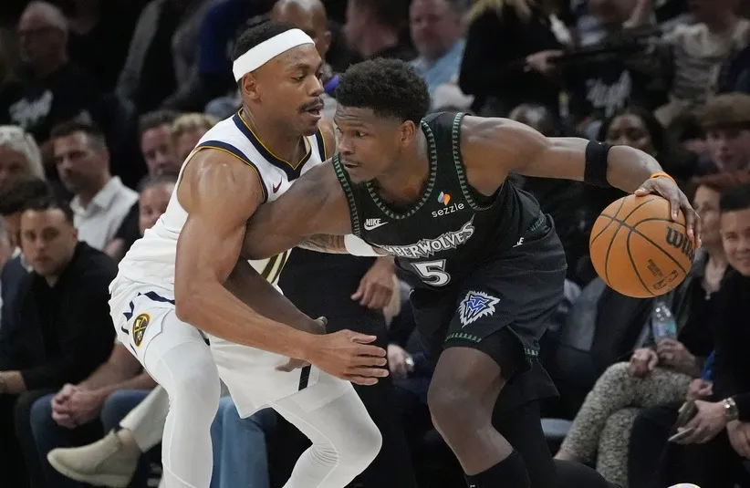 Minnesota Timberwolves guard Anthony Edwards (5) works around.