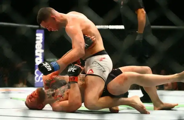 Nate Diaz (top) against Conor McGregor during UFC 196.