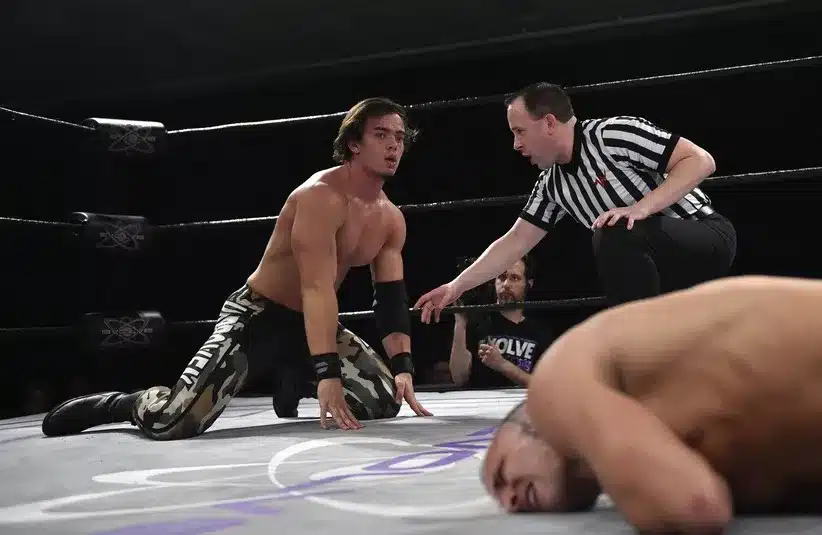 Darby Allin competes in the ring against Austin Theory.