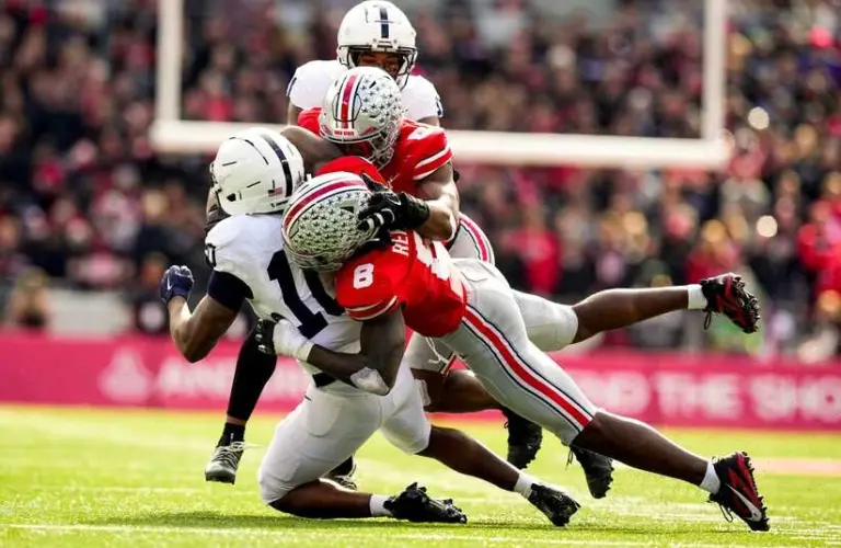 Ohio State Buckeyes linebacker Arvell Reese (8) and linebacker Sonny Styles (0) tackle Penn State Nittany Lions running back Nicholas Singleton (10) in the second half of the college football game at Ohio Stadium on Saturday, Nov. 1, 2025 in Columbus, Ohio.