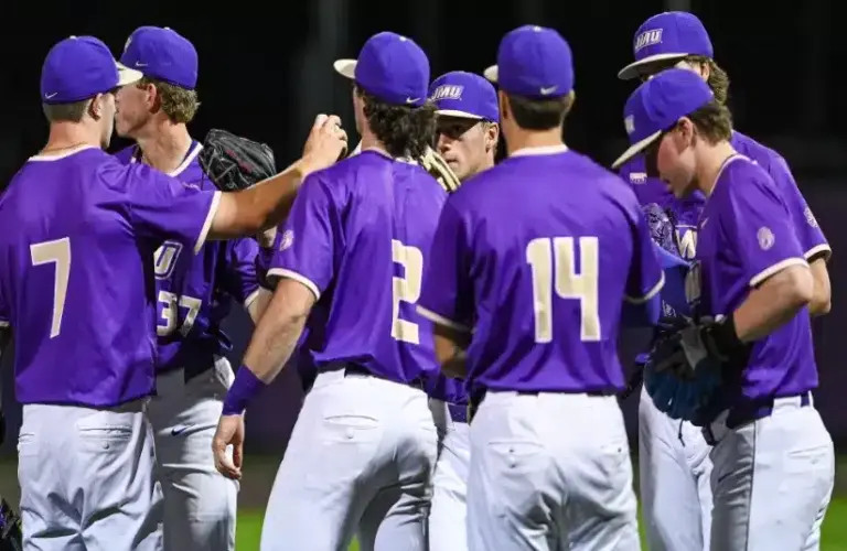 James Madison Baseball team huddles together following loss.