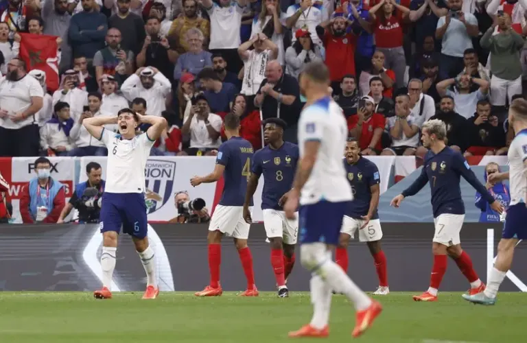 England defender Harry Maguire (6) reacts after a play during the second half of a quarterfinal game against France in the 2022 FIFA World Cup.