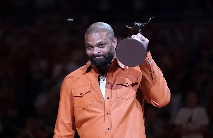 PJ Tucker is awarded the Texas Athletics Hall of Honor trophy.