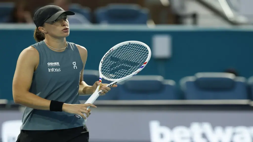 Iga Swiatek (POL) reacts after missing a shot