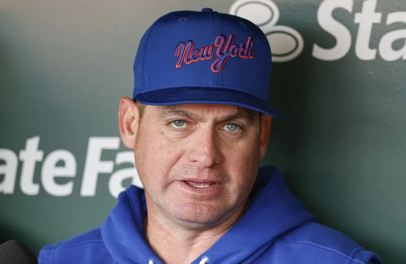 Former New York Mets manager Carlos Mendoza (64) speaks before a baseball game. The Mets wrap up a series today with the Yankees.