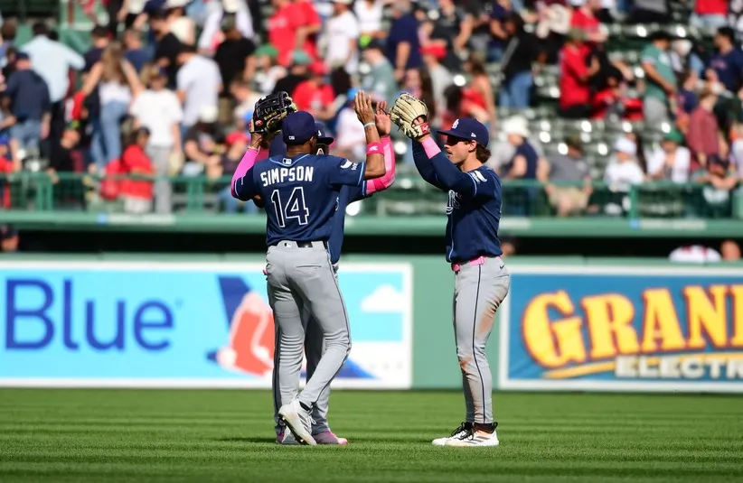 Tampa Bay Rays left fielder Chandler Simpson (14) center fielder Cedric Mullins (31) and right fielder Jonny DeLuca (21) celebrate. The Rays play at the Yankees September 22-24.