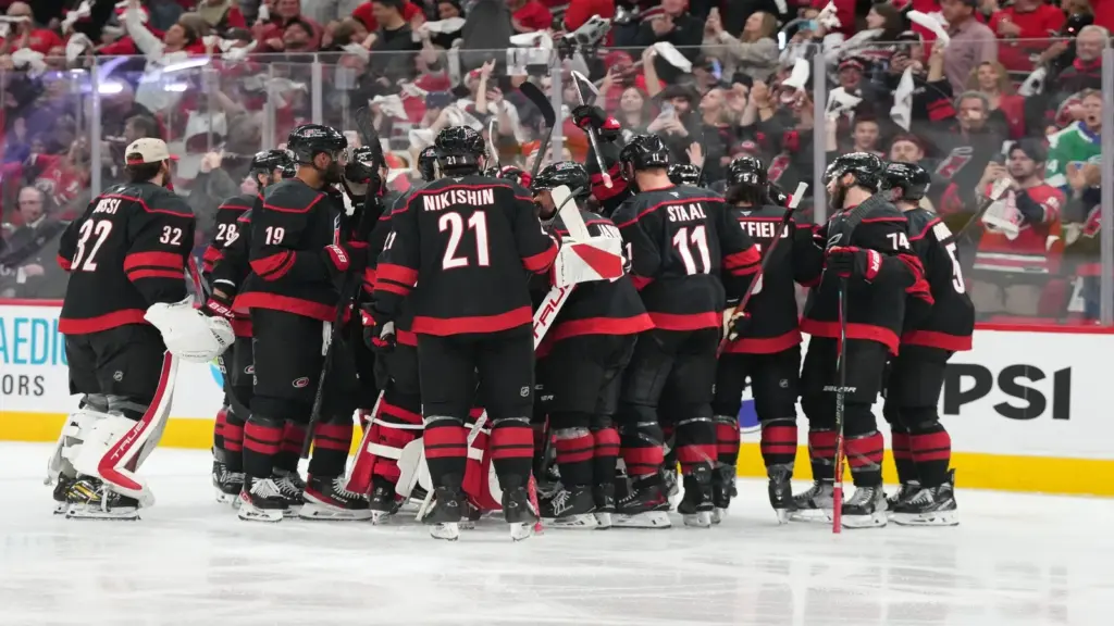 Carolina Hurricanes players celebrate an overtime goal at Lenovo Center, site of the Capitals vs. Hurricanes season opener
