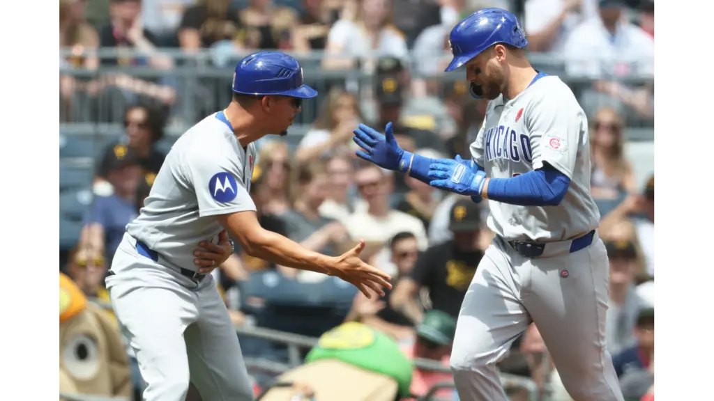Cubs players celebrating in Pittsburgh