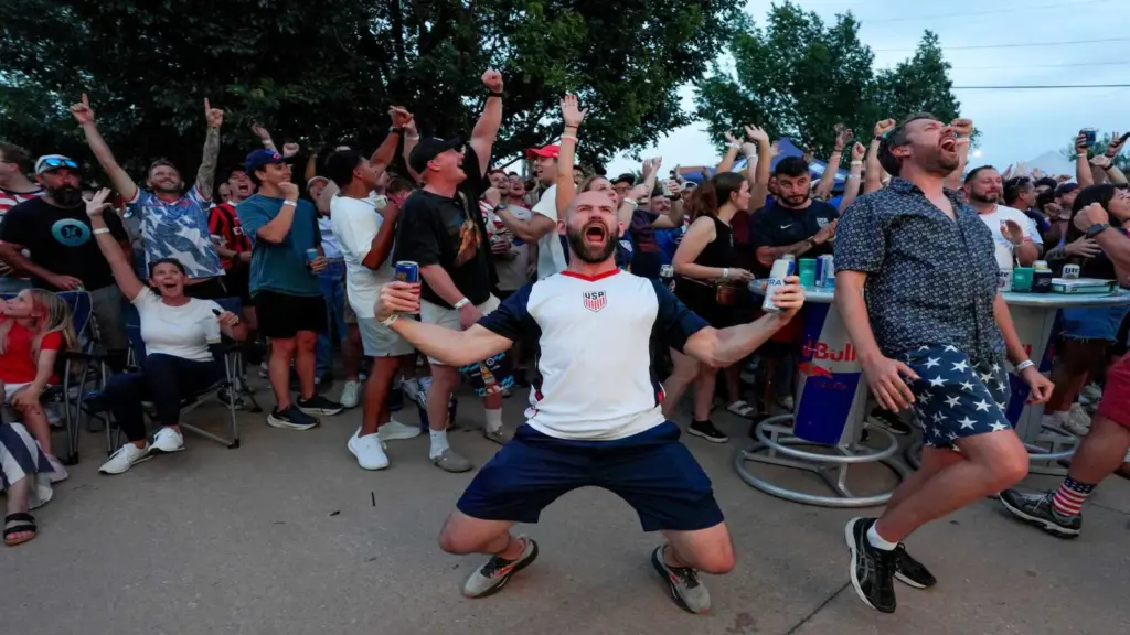 Trent Jameson cheers after a goal with other soccer fans during a watch party at Skinny Slim's in Oklahoma City for the FIFA World Cup game between the United State's men's team and, Friday, June 12, 2026.