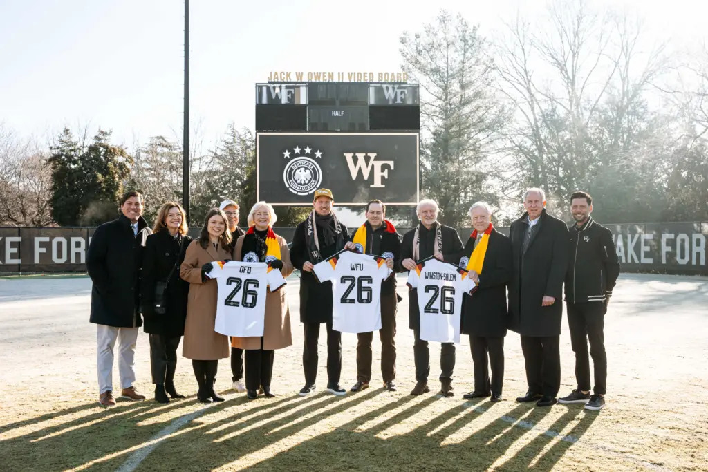 Dec 7, 2025; Winston-Salem, North Carolina, USA; Wake Forest University President Dr. Susan Wente, German head coach Julian Nagelsmann, Wake Forest University vice president and director of athletics John Currie, Director of the German national team Rudi Voller, and members of the German Football Association pose for a portrait at W. Dennie Spry Soccer Stadium. The German Football Association chose Wake Forest University as its Team Base Camp for FIFA World Cup 2026. Mandatory Credit: Wake Forest University via Imagin Images