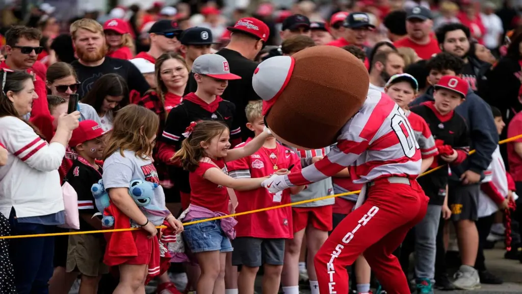 Brutus Buckeye interacts with fans as the team arrives for the Ohio State football spring game at Ohio Stadium in Columbus on April 18, 2026.