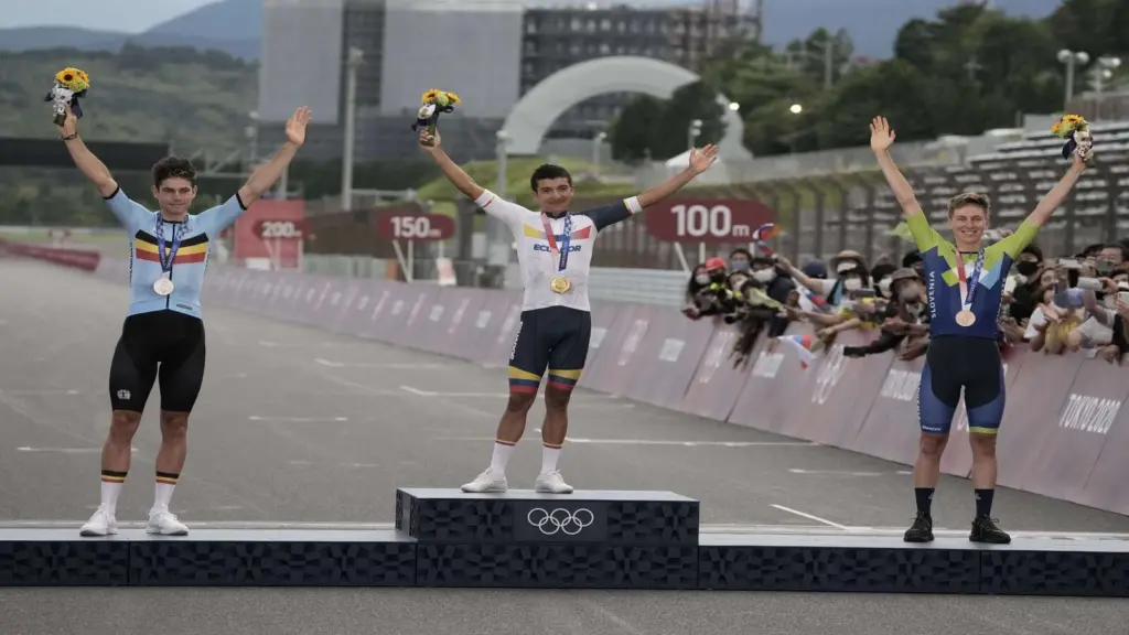 Jul 24, 2021; Shizuoka, Japan; From left, Wout van Aert (BEL), Richard Carapaz (ECU) and Tadej Pogacar (SLO) on the podium after the Men's Road Race during the Tokyo 2020 Olympic Summer Games at Fuji Speedway. Carapaz won gold, van Aert won silver, and Pogacar won bronze.