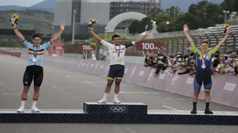 Jul 24, 2021; Shizuoka, Japan; From left, Wout van Aert (BEL), Richard Carapaz (ECU) and Tadej Pogacar (SLO) on the podium after the Men's Road Race during the Tokyo 2020 Olympic Summer Games at Fuji Speedway. Carapaz won gold, van Aert won silver, and Pogacar won bronze.