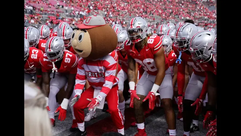 Sept. 9, 2023; Columbus, Oh., USA; Brutus Buckeye and Ohio State Buckeyes tight end Gee Scott Jr. (88) take a stance as the Ohio State Buckeyes huddle up before Saturday's NCAA Division I football game against the Youngstown State Penguins at Ohio Stadium.