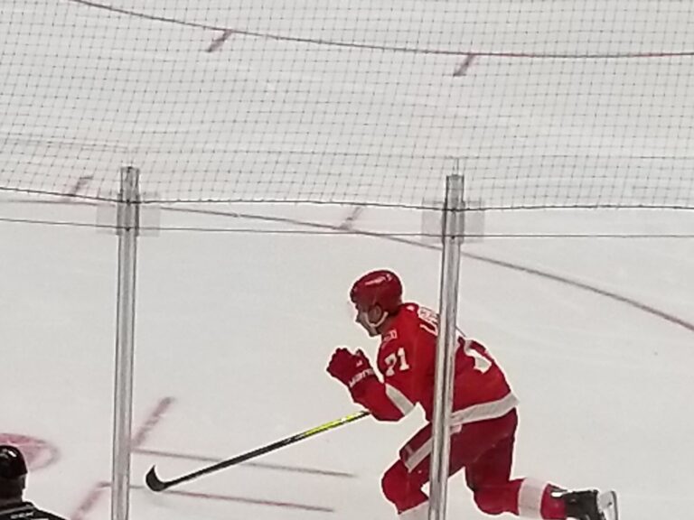 Detroit Red Wings center Dylan Larkin skates during a 2018 home game; a Dylan Larkin injury will keep him out of the first two games of 2026-27