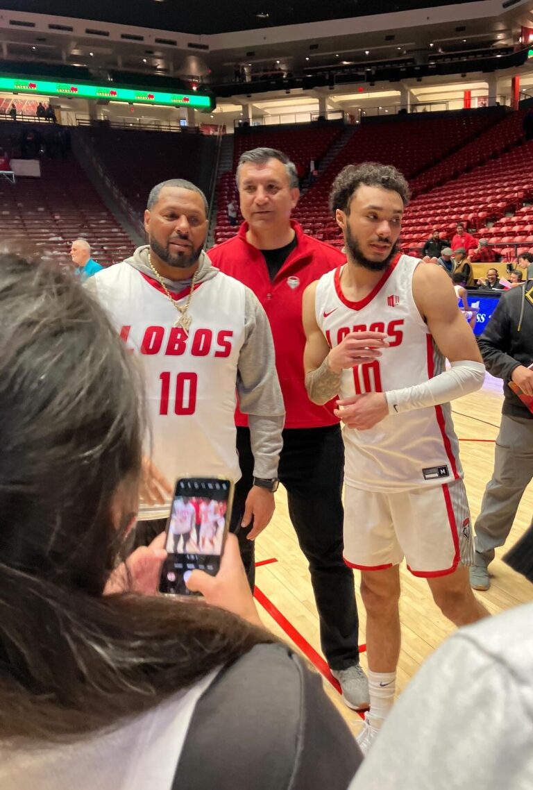 Jaelen House, in his New Mexico uniform, with his father, former NBA guard Eddie House, after a Lobos game in March 2024